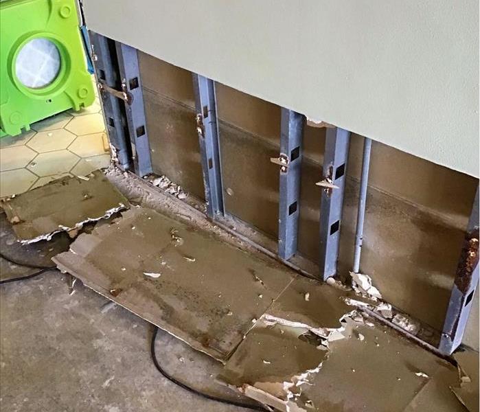 SERVPRO drying equipment and removed materials from a water damaged wall in a Deerfield Beach, FL business