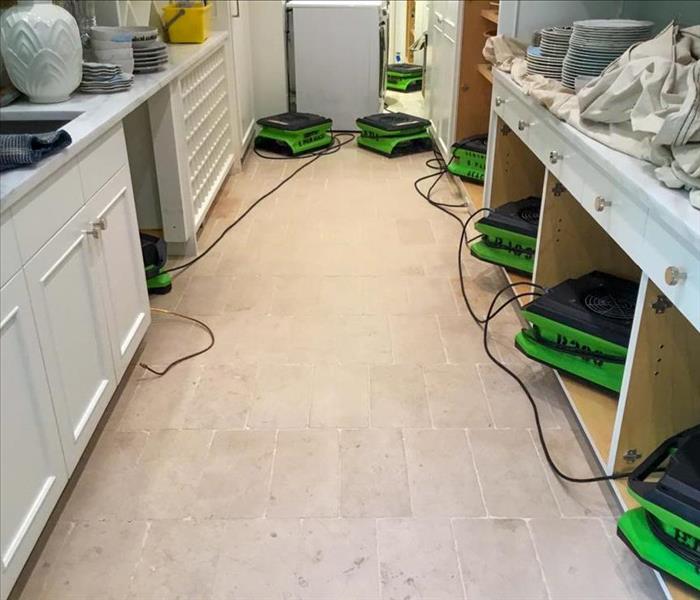 SERVPRO drying equipment in the kitchen of a Deerfield Beach home.
