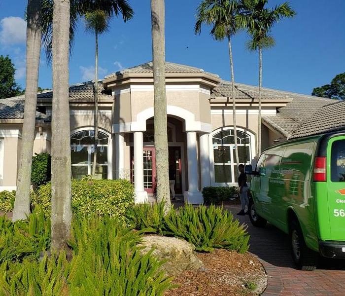 SERVPRO of Deerfield Beach truck parked in the driveway of a local home.